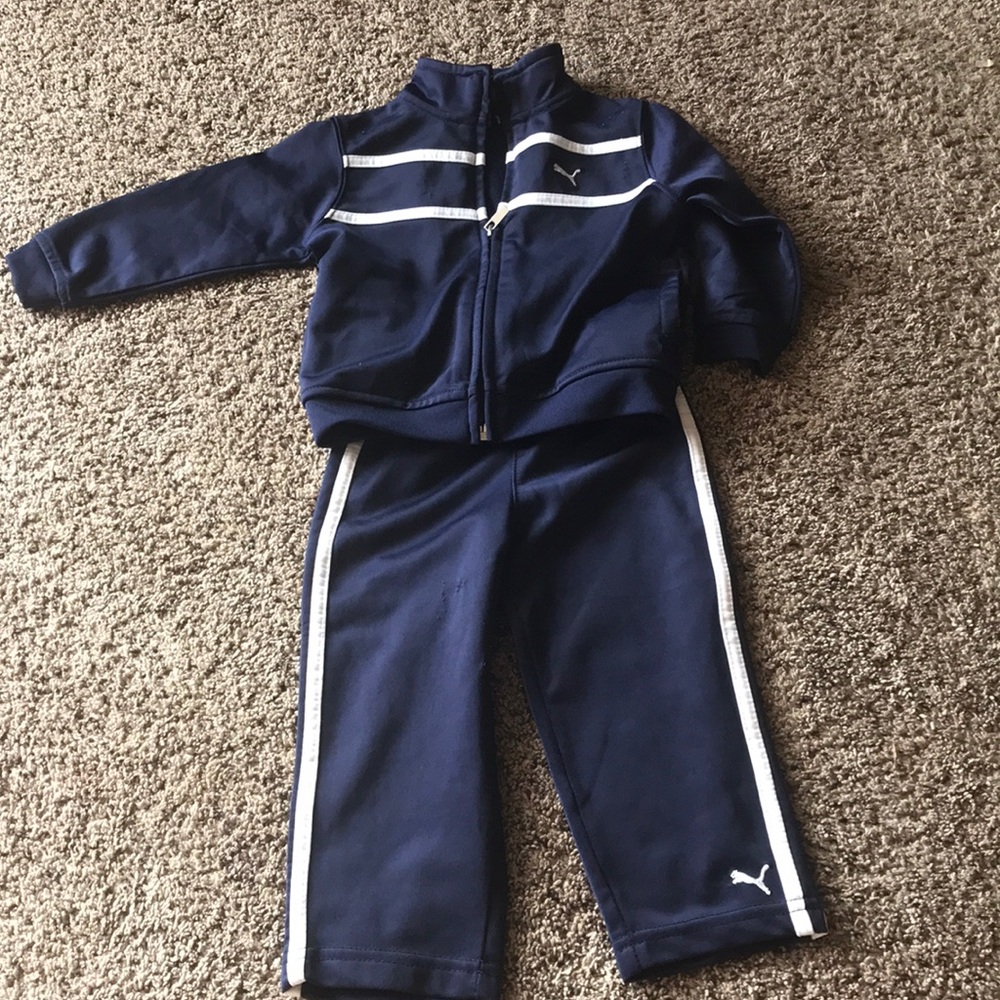 Puma track suit; navy blue